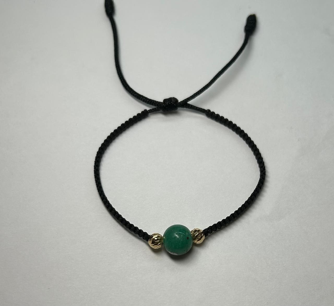 PULSERA TEJIDA A MANO ESFERA EN ORO 18KTE Y ESFERA ESMERALDA